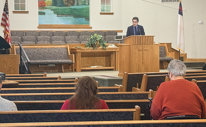 Man teaching from the pulpit during Sunday School at Huber Heights Baptist Temple with attentive congregation seated in pews