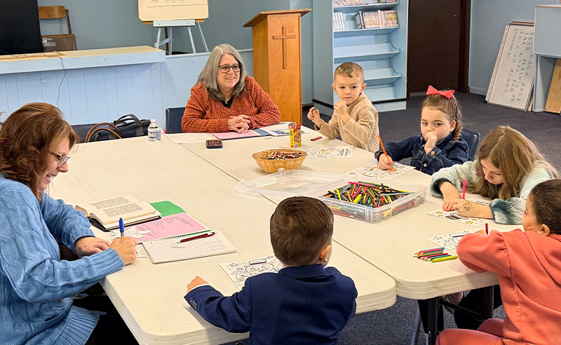 Children's Sunday School class at Huber Heights Baptist Temple with teacher and young students doing crafts and Bible lesson