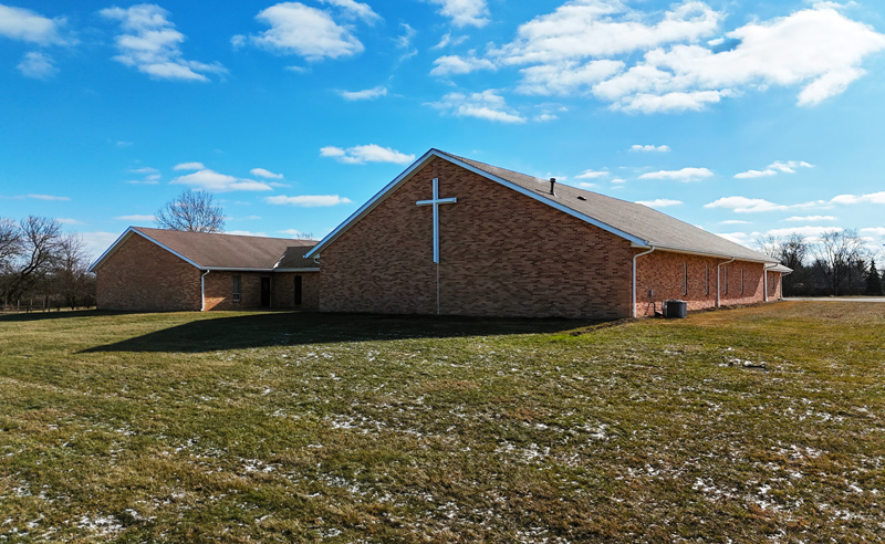 Current exterior view of Huber Heights Baptist Temple church building in Huber Heights, Ohio with large cross on brick facade