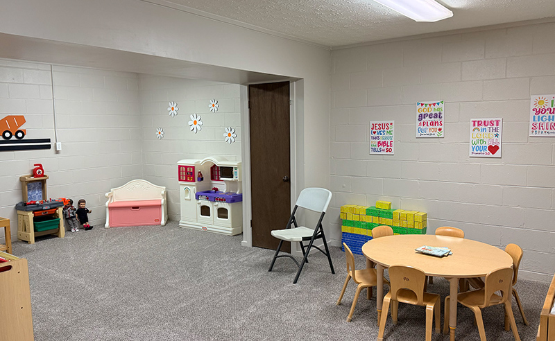 Church nursery at Huber Heights Baptist Temple with play kitchen, toys, table and chairs for young children