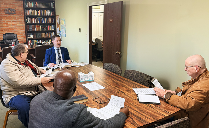 Men's discipleship Bible study around conference table at Huber Heights Baptist Temple