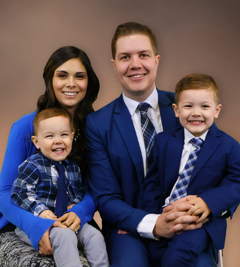 Pastor Caleb Gerber with his wife Grace, and sons Luke and Ezekiel