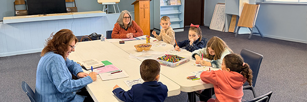 Children's Sunday School class at Huber Heights Baptist Temple with teacher and young students doing crafts and Bible lesson