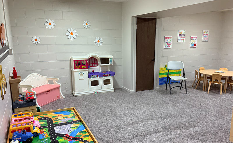 Church nursery at Huber Heights Baptist Temple with play kitchen, toys, table and chairs for young children