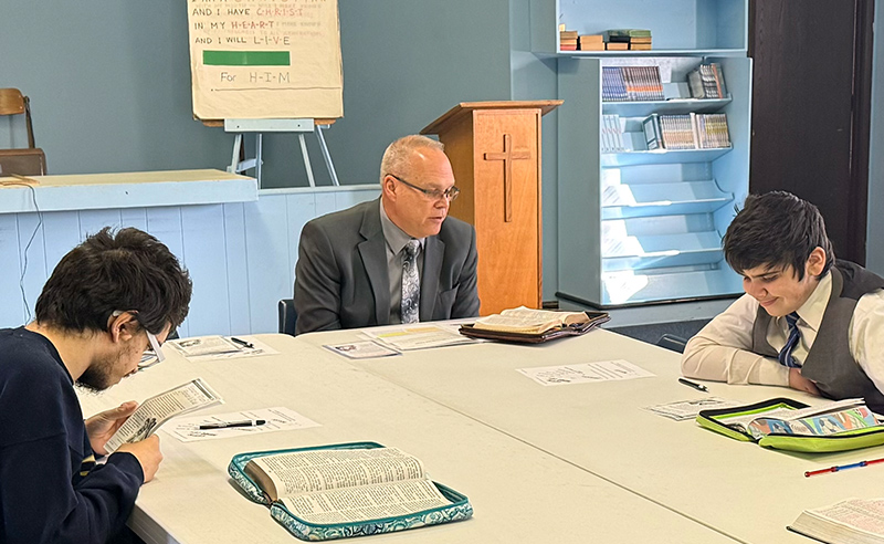 Teen Bible study group at Huber Heights Baptist Temple with Youth Director Jimmy Sexton studying Scripture together