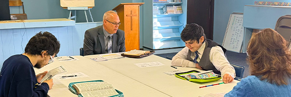 Teen Bible study group at Huber Heights Baptist Temple with Youth Director Jimmy Sexton studying Scripture together